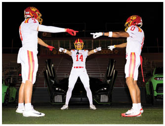 A group of football players on a field. Description generated by AI