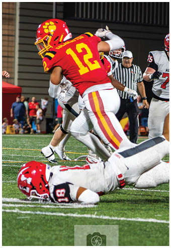 A group of football players celebrating a touchdown. Description generated by AI