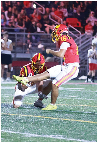 A group of football players celebrating a touchdown. Description generated by AI