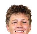 A young man wearing a white jersey with the number 10 on it. Description generated by AI
