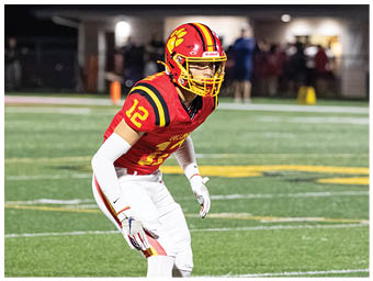 A football player running on the field. Description generated by AI