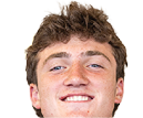 A young man wearing a white jersey with the number 10 on it. Description generated by AI