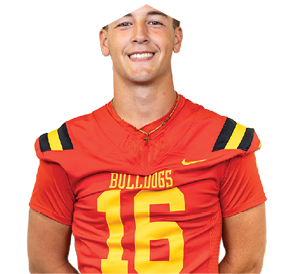 A young man wearing a white jersey with the number 10 on it. Description generated by AI