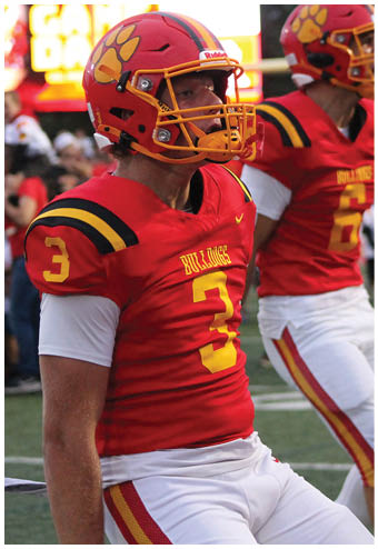 A group of football players celebrating a touchdown. Description generated by AI