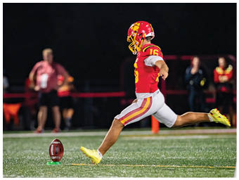 A football player running on the field. Description generated by AI