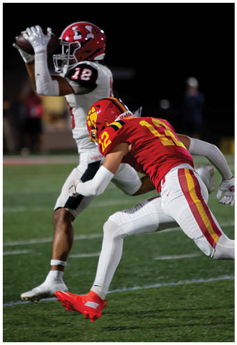 A group of football players celebrating a touchdown. Description generated by AI