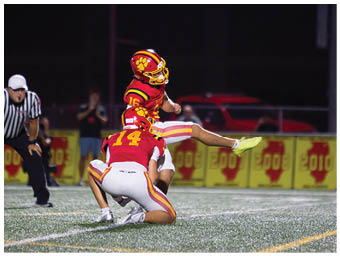 A football player running on the field. Description generated by AI