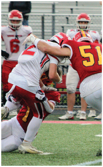 A football player catching a ball. Description generated by AI