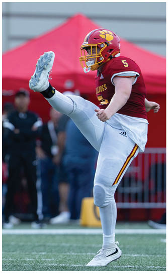 A football player catching a ball. Description generated by AI