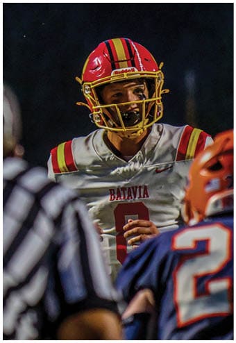 A group of football players celebrating a touchdown. Description generated by AI