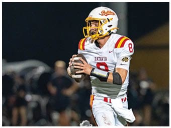 A football player running on the field. Description generated by AI