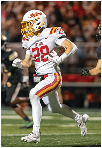 A group of football players celebrating a touchdown. Description generated by AI