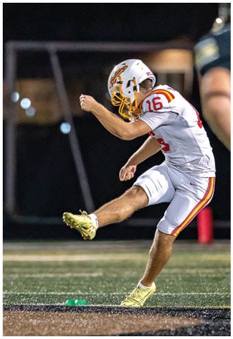 A group of football players celebrating a touchdown. Description generated by AI