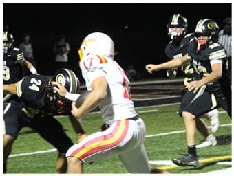 A football player running on the field. Description generated by AI