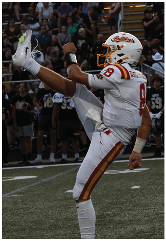 A group of football players celebrating a touchdown. Description generated by AI