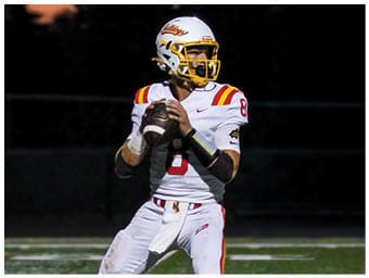 A football player running on the field. Description generated by AI