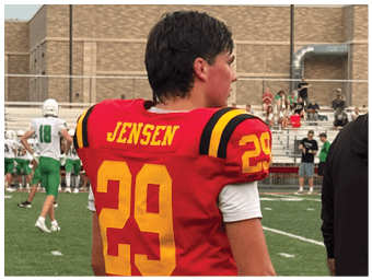 A football player running on the field. Description generated by AI