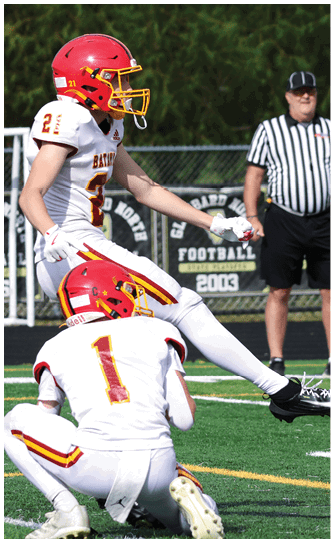 A football player catching a ball. Description generated by AI