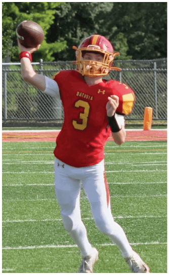 A football player catching a ball. Description generated by AI