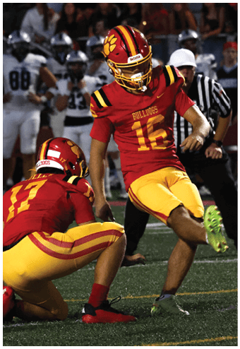 A group of football players celebrating a touchdown. Description generated by AI