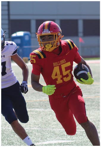 A group of football players celebrating a touchdown. Description generated by AI