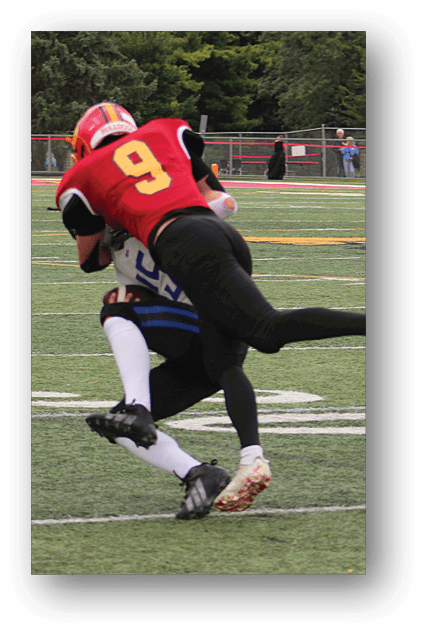 A football player catching a ball. Description generated by AI