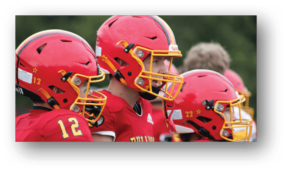 A group of football players on a field. Description generated by AI