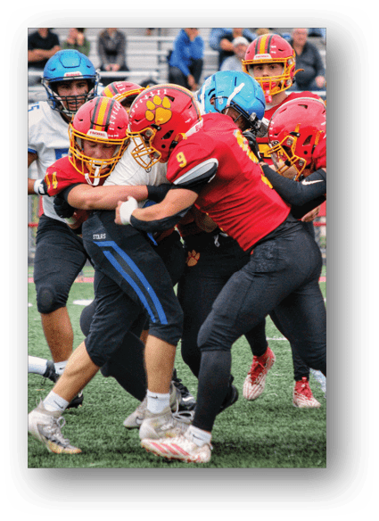 A football game is being played on a field. Description generated by AI