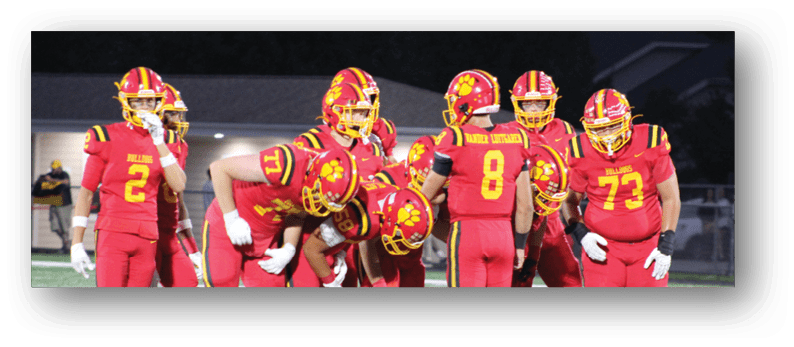A group of football players on a field. Description generated by AI