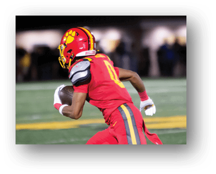 A football player running on the field. Description generated by AI