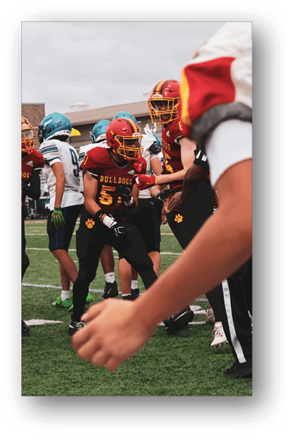 A football player catching a ball. Description generated by AI