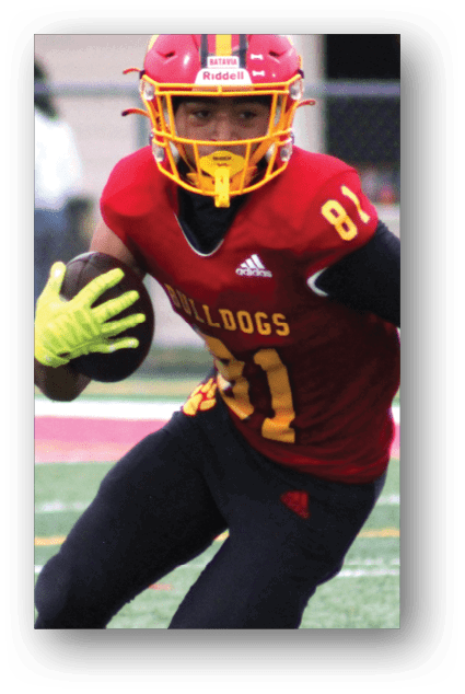A football player catching a ball. Description generated by AI