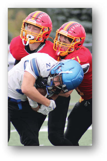 A football player catching a ball. Description generated by AI