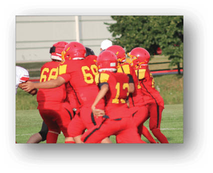 A group of football players on a field. Description generated by AI