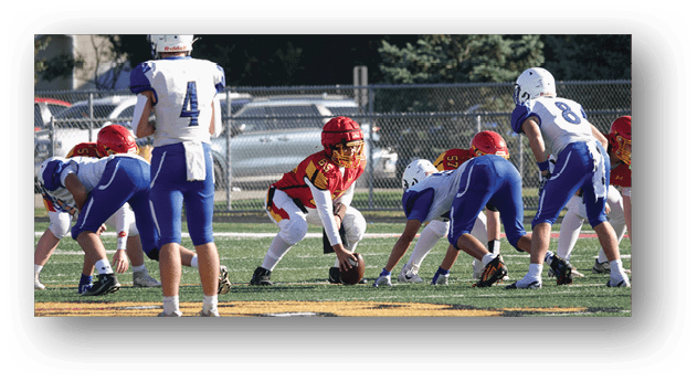 A football player wearing a blue and white uniform. Description generated by AI