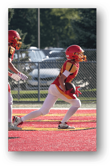 A football player catching a ball. Description generated by AI