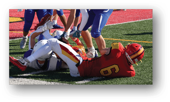 A group of football players on a field. Description generated by AI