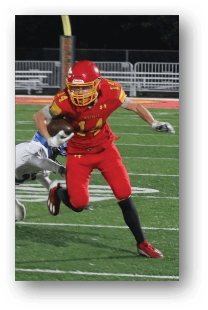 A football player catching a ball. Description generated by AI