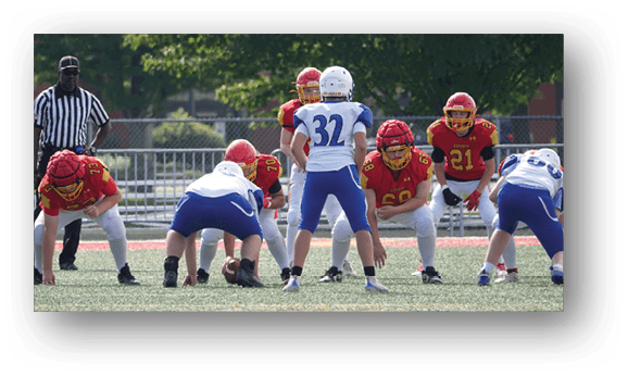 A group of football players on a field. Description generated by AI