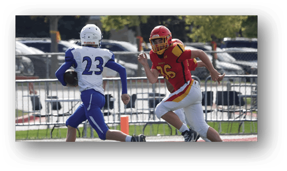 A group of football players on a field. Description generated by AI