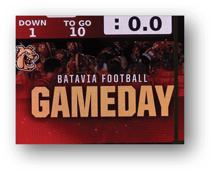 A group of football players on a field. Description generated by AI