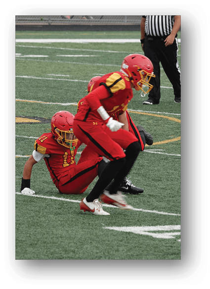 A football game is being played on a field. Description generated by AI
