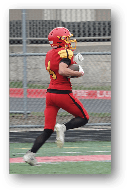 A football player catching a ball. Description generated by AI