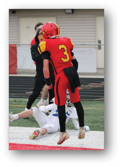 A football game is being played on a field. Description generated by AI
