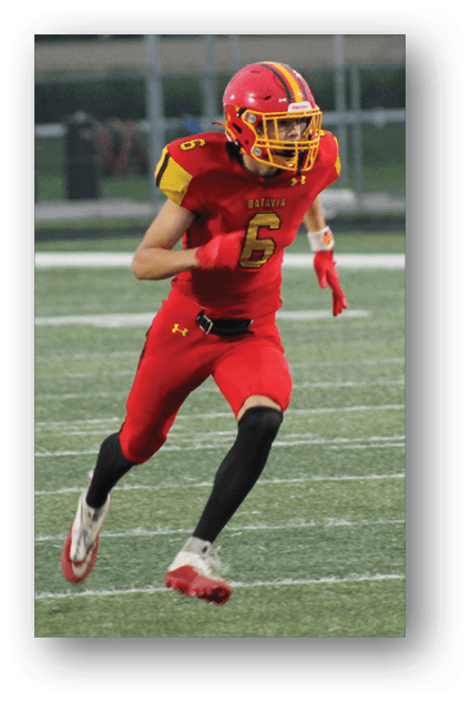 A football player catching a ball. Description generated by AI