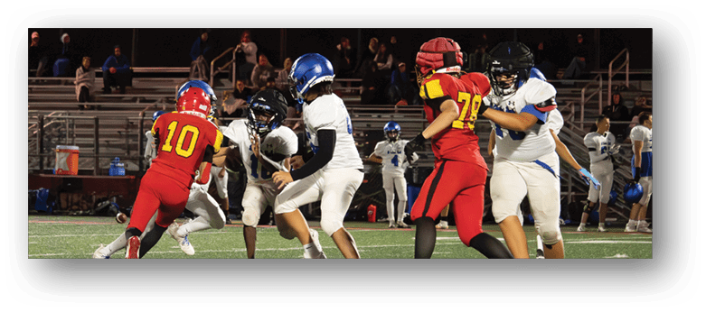 A football player wearing a blue and white uniform. Description generated by AI