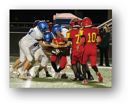 A group of football players on a field. Description generated by AI