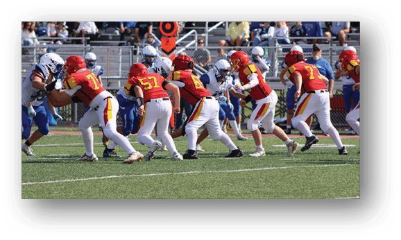 A group of football players on a field. Description generated by AI