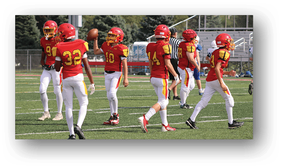 A group of football players on a field. Description generated by AI