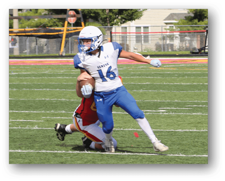 Three football players in blue and white uniforms running on a field. Description generated by AI